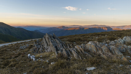 View from Serra da Arada over mountain landscape at evening sunset with sharp rocks in foreground, Sao Pedro do Sul, Portugal - obrazy, fototapety, plakaty