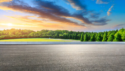 wide race track and green woods nature landscape at sunset