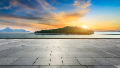 empty square floor and sea with island natural landscape at sunset
