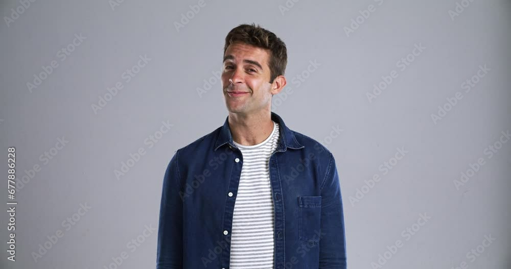 Poster face, smile and idea with a young man in studio isolated on gray background to relax while feeling p
