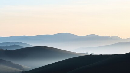 A serene sunrise over misty mountains, creating a captivating view of nature's beauty.