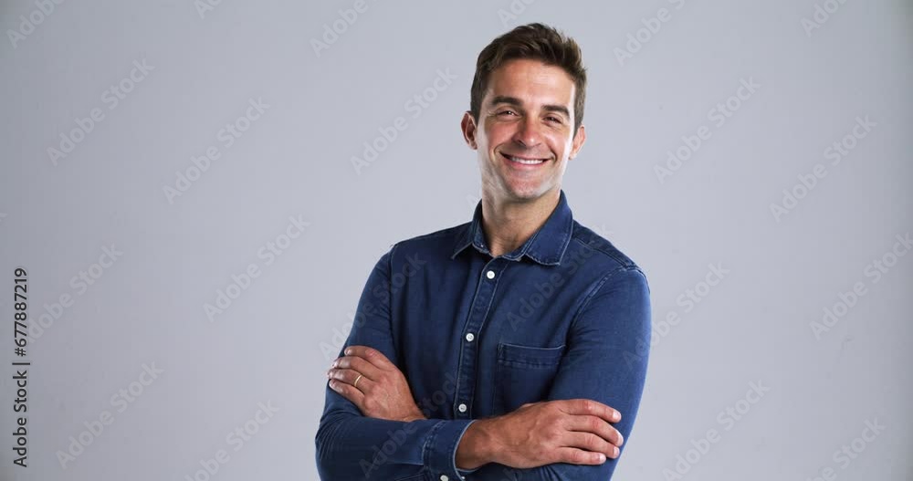 Poster man, face and arms crossed with smile in studio, confident and fashion with pride mindset by gray ba
