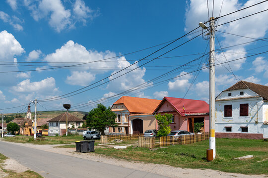 Empty Rural village street with traditional colourful houses, Dacia, Transylvania, Romania