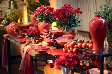 beautiful party table decorated with flowers, fruits, vegetables and ceramics