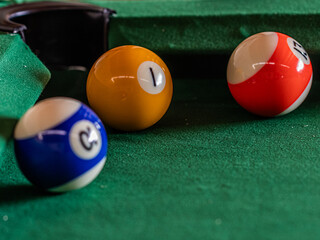 Billiard table setup featuring colorful pool balls, ready for an exciting game of cue sports