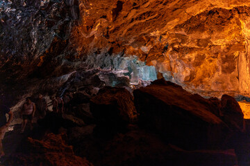 cueva de los verdes, colorful vulcanic rocks in cave with lake still calm reflecting, lava tube in Lanzarote, Canary Islands
