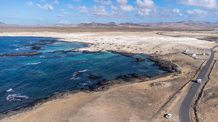 Sandy desert dunes Corralejo in Fuerteventura, Canary islands, Spain,  summer vacation panoramic high view drone