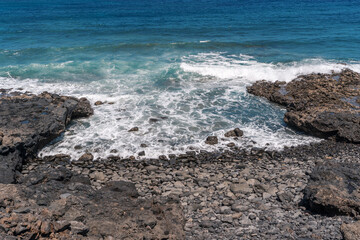 ocean waves breaking on secluded rocky cove