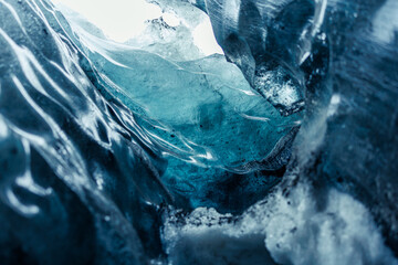 Frozen ice cap in vatnajokull caves melting due to global warming, frosty icelandic rocks forming...