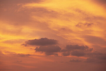 Naklejka na ściany i meble Red orange cloudy sky highlighted by Sunset, tropical Thailand. Close up photo.