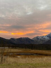 Obraz premium View of the valley and mountains against the background of the beautiful sky at sunset.
