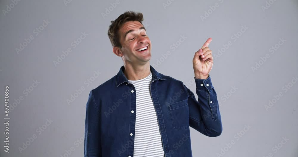 Aufkleber man, smile and pointing up with promotion in studio, advertising presentation by gray background. pe