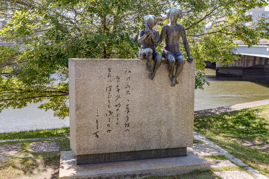 Hiroshima, Japan - 2 June 2023: Mother and Children statue at Hiroshima Peace Memorial Park. The ruin memorial to the people who were killed in the atomic bombing of Hiroshima on 1945.