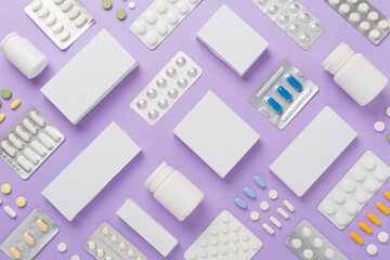 Flat lay with different pills in blister packaging and boxes and on color background