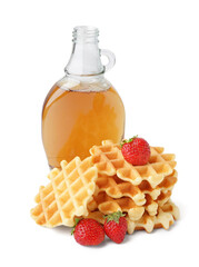 Tasty waffles with strawberries and bottle of maple syrup on white background