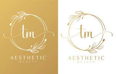 Letter TM Beauty Logo with Flourish Ornament - obrazy, fototapety, plakaty