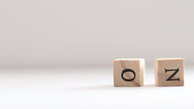 A finger flicks and trips over the word NO spelled in block letters