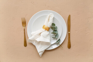 Stylish table setting on beige background