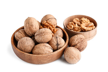Bowls of tasty walnuts on white background