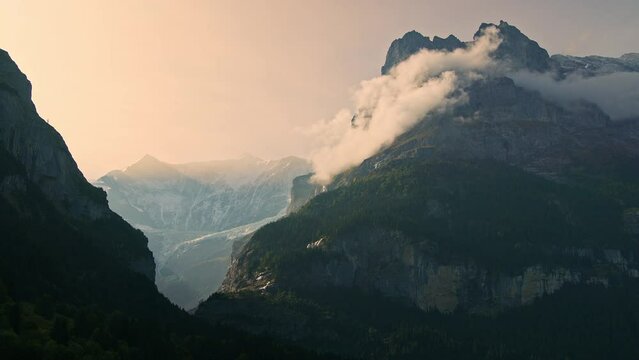 Timelapse of clouds moving along the mountains in the Swiss Alps near Grindelwald Switzerland.
