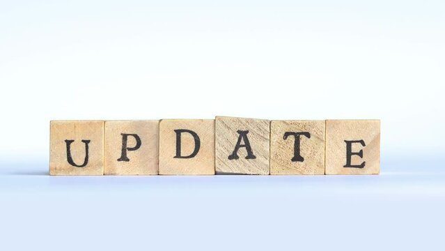 Hand brings forward the word UPDATE spelled as block letters