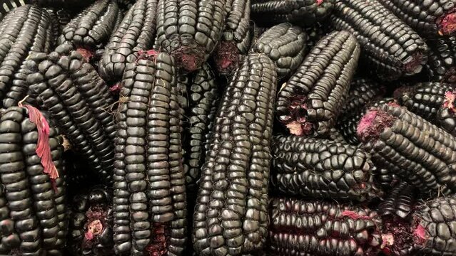 Video of Peruvian purple corn in a local market. Food concept.
