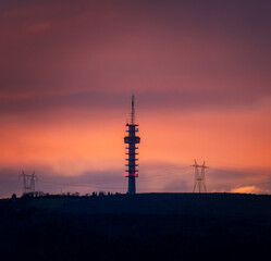 Sunset with mountain views and a radio tower