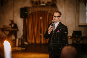 man with microphones on party