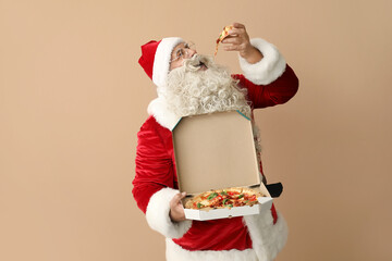 Santa Claus eating tasty pizza on beige background