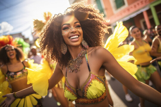 Fototapeta Latin woman dancing on the streets during carnival. Brazilian woman wearing costume celebrating carnival.