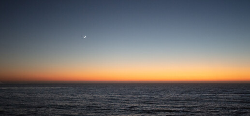 Sunset moon on the California central coast at Big Sur on the west coast of the United States