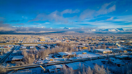 Snowy Mountains over a frozen city