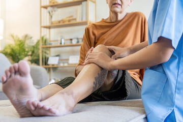 Elderly women have knee pain from osteoarthritis and have their symptoms examine by doctor for...
