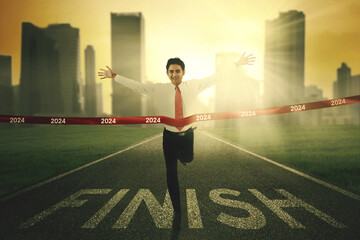 Successful business man crosses the 2024 finishing line