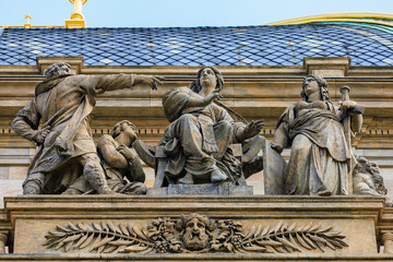 Ancient sculptures in the architecture of the city. Historical and cultural heritage. Background.