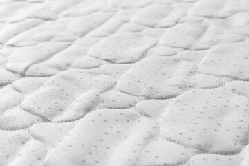 New light green mattress as background, closeup