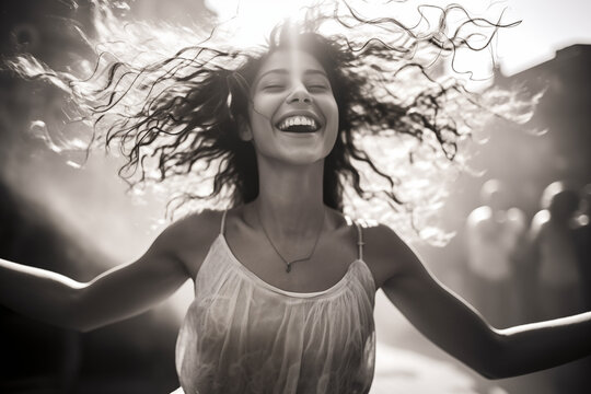 Person expressing sheer joy or euphoria, whether through dance, laughter, or an exuberant gesture