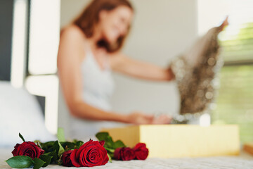 Obraz na płótnie Canvas Woman, roses and box with gift in bedroom on birthday, celebration and valentines day event in home. Girl, dress and fashion with bouquet, flowers and floral present with thinking on bed in house