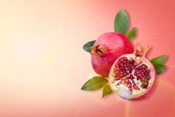 Pomegranate fruit sliced with seeds, food concept