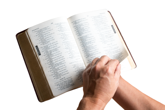 Man reading and turning the page of the Holy Bible. Close up shot. Isolated, transparent background.
