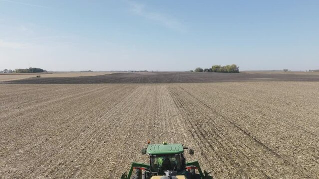 Tractor Pulling Strip Till Machine to Prepare for Seeding, Aerial