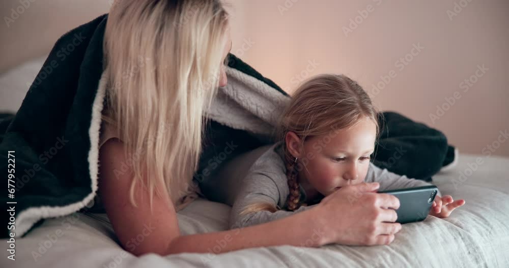 Poster Mom, daughter and smartphone in bedroom, playing and watching in bed, tech and talking. Happiness, enjoying and online for childhood, digital and internet in family home, games and bonding together