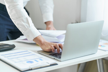 Young business man busy working at office. businessman doing financial paperwork business management concept