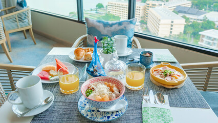 Thai breakfast in a luxury hotel in Thailand, noodle soup, and Thai egg pan, table with Asian breakfast