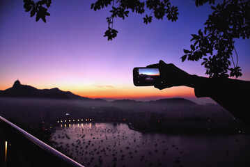 Photographing Guanabara Bay and Corcovado Mountain with a Cell Phone from the Sugarloaf at Dusk -...