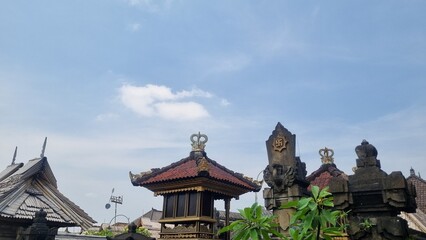 Fototapeta premium Traditional Balinese temple. Used as a place of worship and worship. Using wood and stone as materials. Straw is used as roof covering.