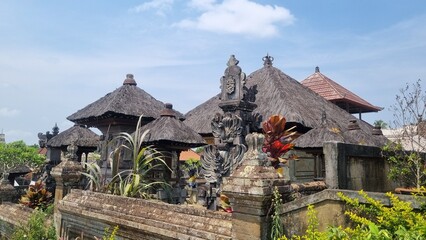 Fototapeta na wymiar Traditional Balinese temple. Used as a place of worship and worship. Using wood and stone as materials. Straw is used as roof covering.