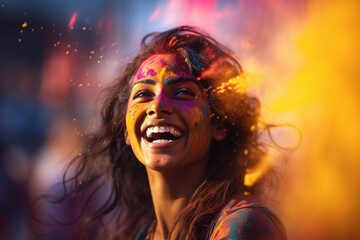 happy indian woman with holi powder on her face at holi festival bokeh style background