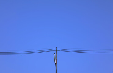 Street lighting. Electrical pole and twilight sky background.