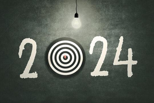 Picture of bull's eye hit the target and light bulb on dartboard with number 2024